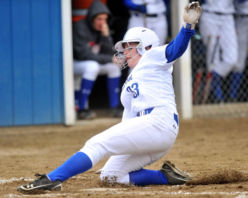 SAFE: Madison’s Sierra LeBlanc slides across home plate in the first inning of the Bulldogs’ game against Mt. Abram on Wednesday in Madison.