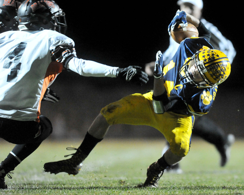 Mt. Blue High School’s Nate Pratt-Holt evades Brunswick defender Aaron Carlton during an Oct. 16 game in Farmington. Pratt-Holt was named a James J. Fitzpatrick Trophy semifinalist Monday.