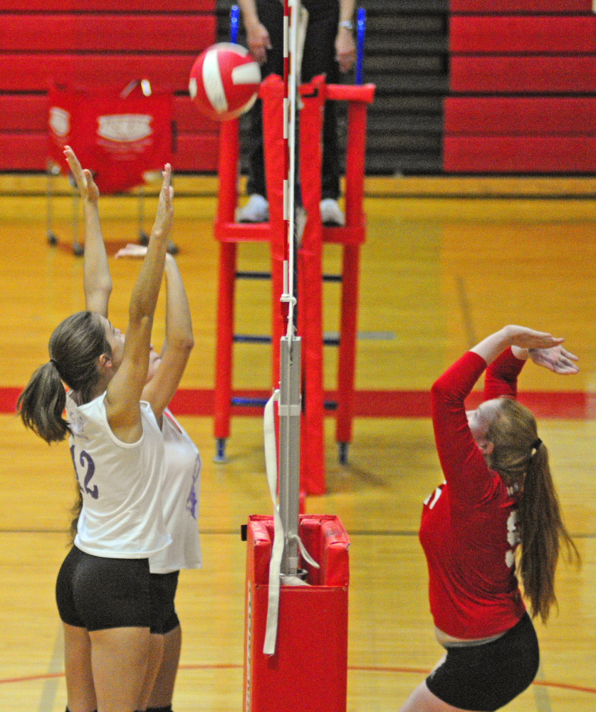 Gardiner's Kiara Goggin, left, and Kasey Boynton and Cony's Lauren Coniff, right, go up for a ball during a scrimmage last month in Augusta.